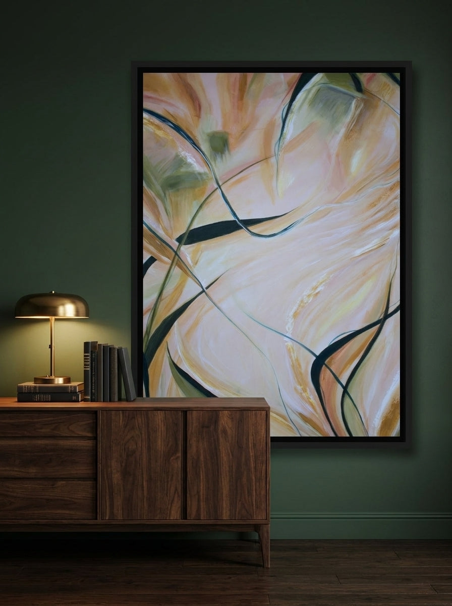 Canvas wall art with a black surround styled on the wall in a moody living room