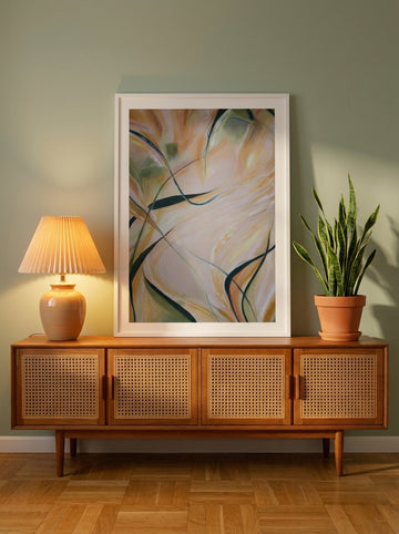 Modern wall art print standing on a sideboard in a mid-century bedroom