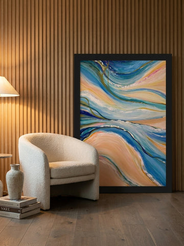 Oversized statement modern wall art print leaning against the wall in a luxe living room
