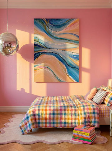 Stretched canvas wall art styled on the wall in a colourful eclectic bedroom