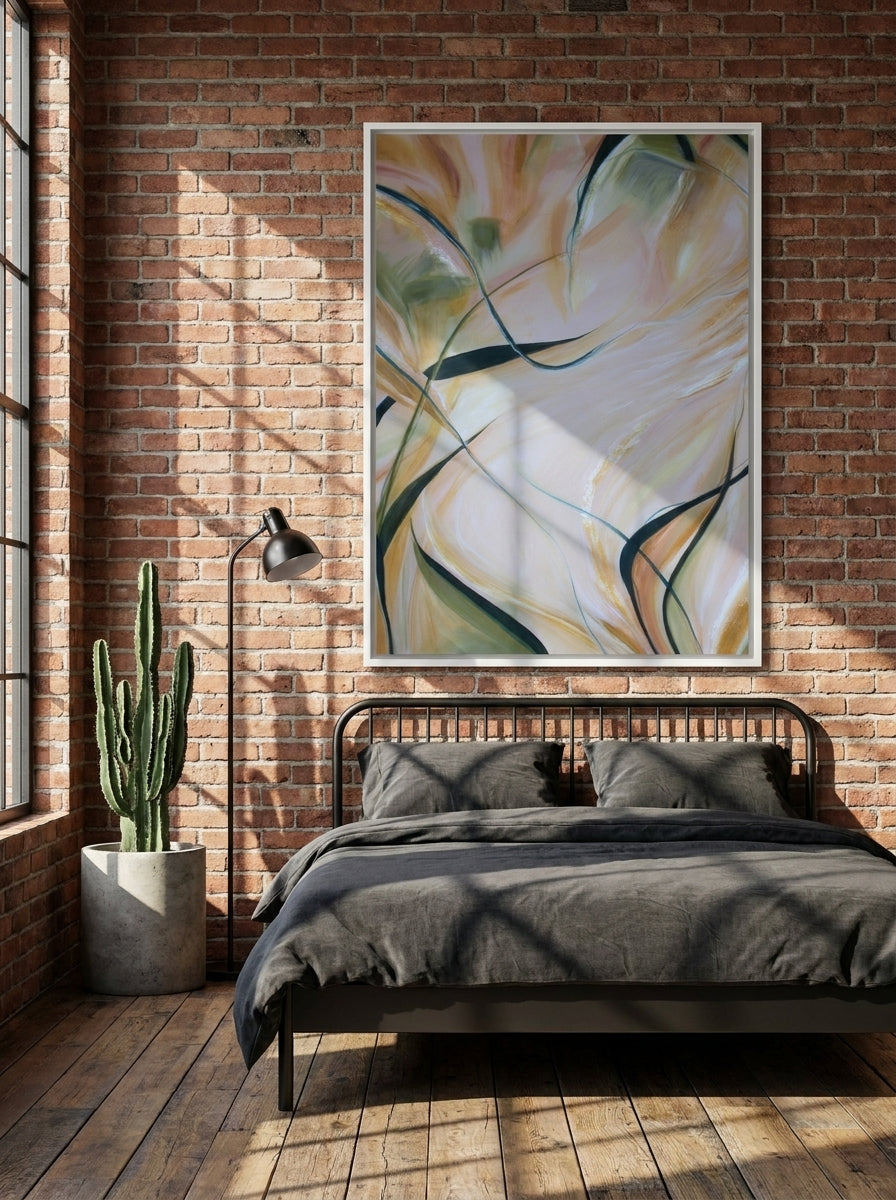 Canvas wall art with a white surround styled on the wall in an industrial loft bedroom