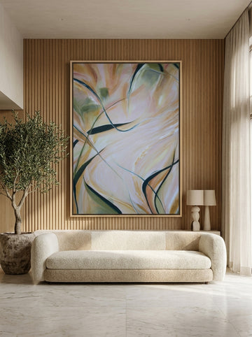 Oversized statement canvas wall art with a natural timber surround styled on the wall in a luxe living room