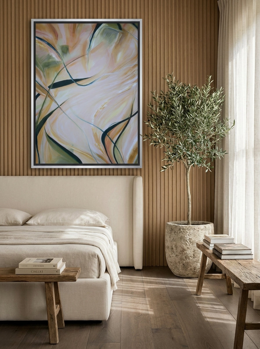 Oversized statement canvas wall art with a silver leaf surround styled on the wall in a luxe bedroom