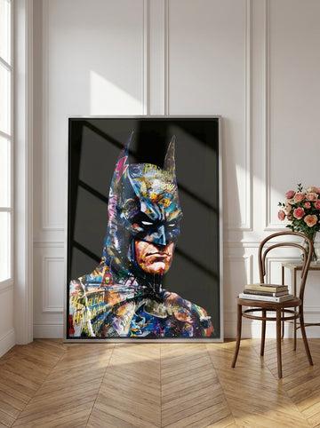 Oversized statement canvas wall art with a silver leaf surround leaning against the wall in a Parisian living room