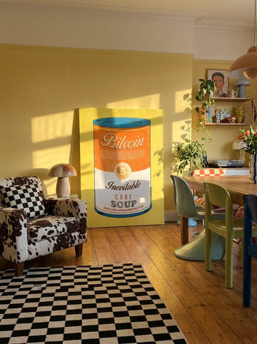 Stretched canvas wall art leaning against the wall in a colourful eclectic dining room
