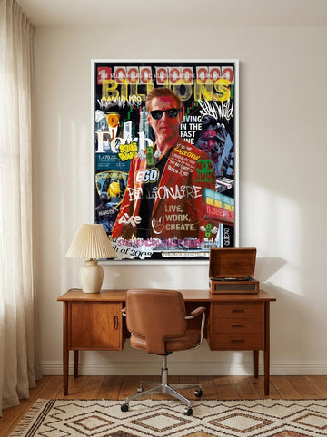 Canvas wall art with a white surround styled on the wall in a mid-century home office