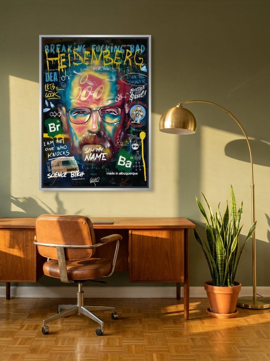 Canvas wall art with a silver leaf surround styled on the wall in a mid-century home office