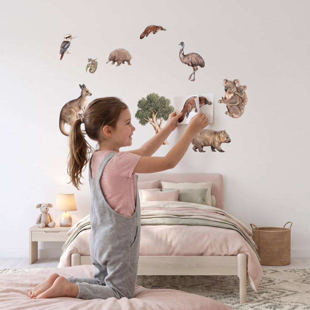 Aussie Bush Babies Wall Decal Set Wall Sticker Decals wall decals: a girl putting the decals up in a girl's bedroom