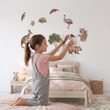 Aussie Bush Babies Wall Decal Set Wall Sticker Decals wall decals: a girl putting the decals up in a girl's bedroom