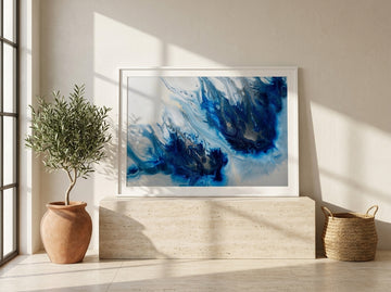 Modern wall art print standing on a console in a Mediterranean bathroom