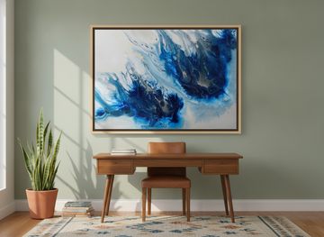 Oversized statement canvas wall art with a natural timber surround styled on the wall in a mid-century home office