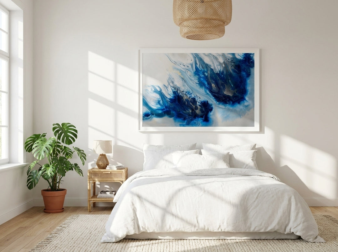 Modern wall art print styled on the wall in a bright Scandinavian bedroom