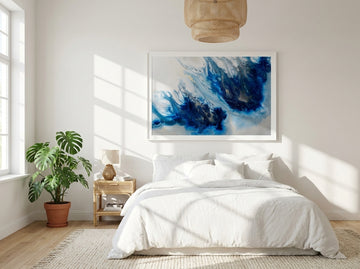 Modern wall art print styled on the wall in a bright Scandinavian bedroom