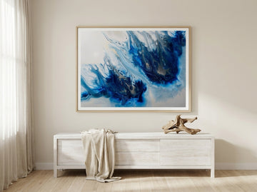 Modern wall art print styled on the wall in a coastal living room