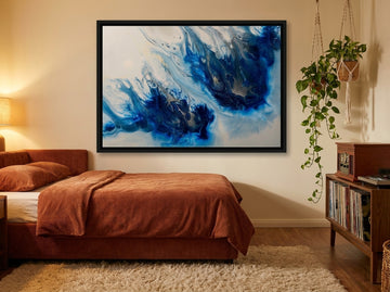 Canvas wall art with a black surround styled on the wall in a retro 70s bedroom
