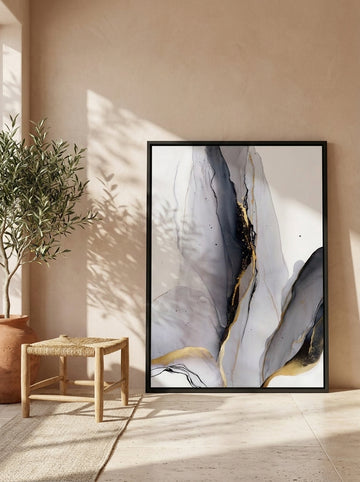Canvas wall art with a black surround leaning against the wall in a Mediterranean living room