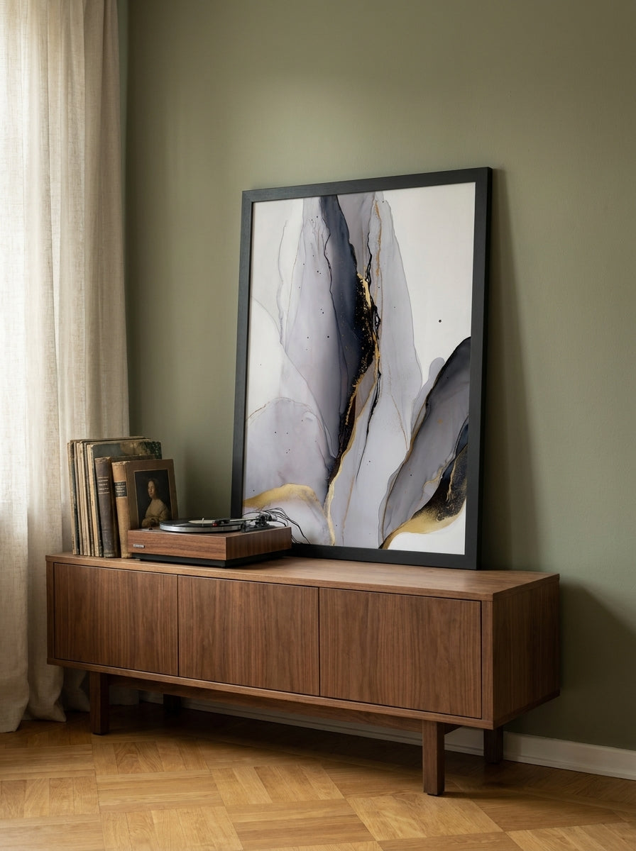 Modern wall art print standing on a sideboard in a mid-century living room