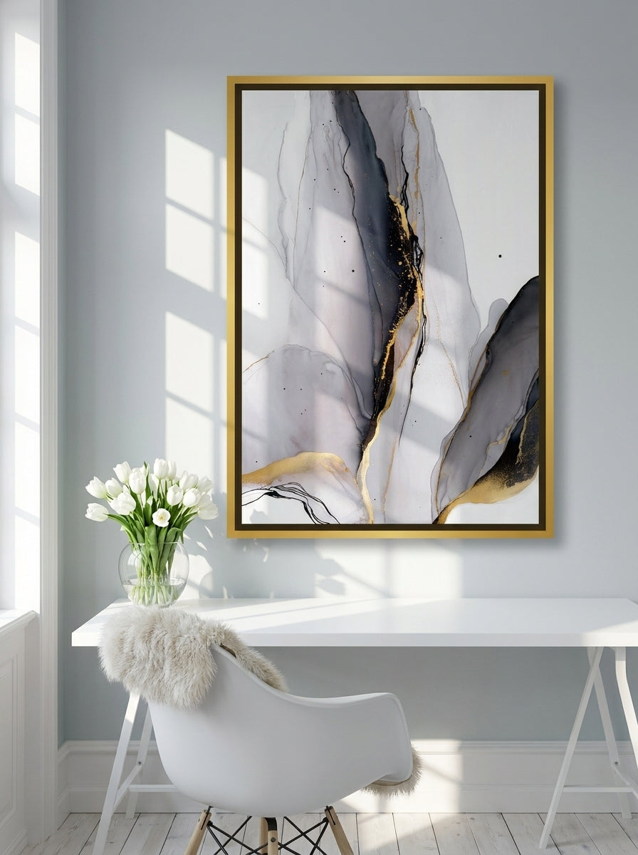 Canvas wall art with a gold leaf surround styled on the wall in a bright Scandinavian home office