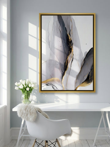 Canvas wall art with a gold leaf surround styled on the wall in a bright Scandinavian home office