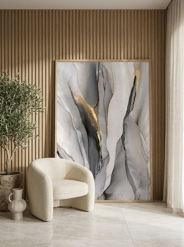 Oversized statement modern wall art print leaning against the wall in a luxe dining room