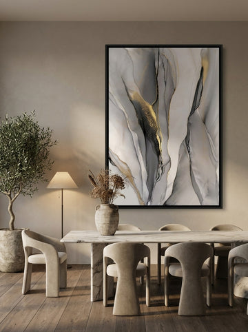 Oversized statement canvas wall art with a black surround styled on the wall in a luxe dining room