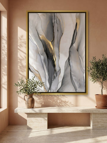 Oversized statement canvas wall art with a gold leaf surround styled on the wall in a Mediterranean living room