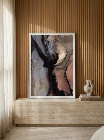 Modern wall art print standing on a console in a luxe bedroom