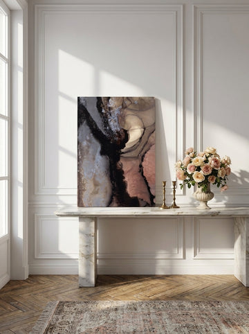 Stretched canvas wall art standing on a console in a Parisian bedroom