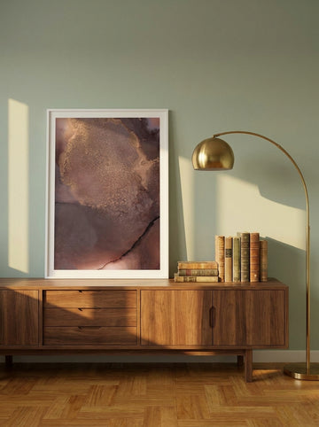 Modern wall art print standing on a sideboard in a mid-century home office