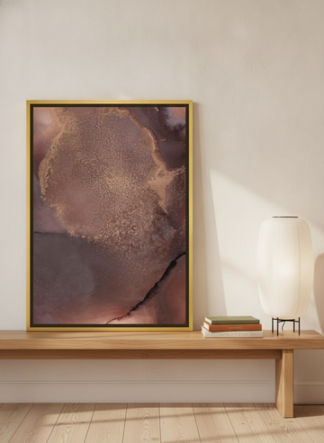 Canvas wall art with a gold leaf surround standing on a bench in a warm Japandi home office