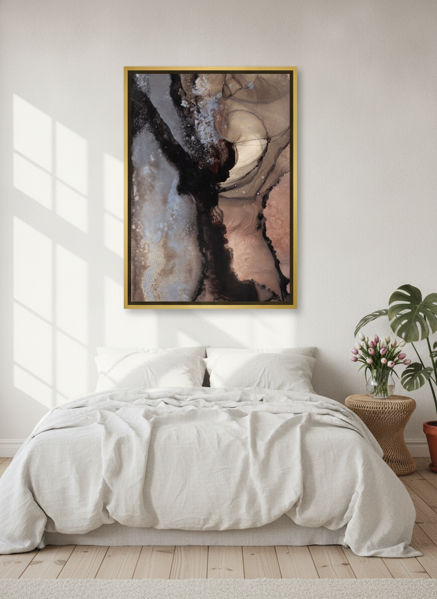 Canvas wall art with a gold leaf surround styled on the wall in a bright Scandinavian bedroom