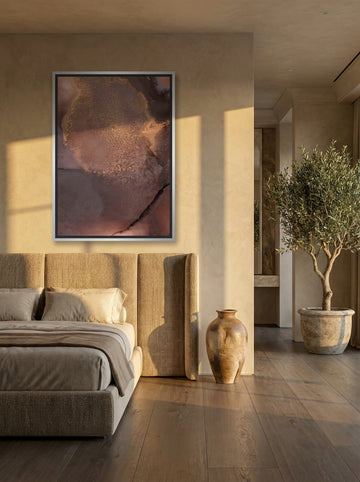 Oversized statement canvas wall art with a silver leaf surround styled on the wall in a luxe bedroom