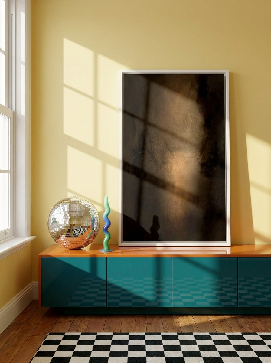 Canvas wall art with a white surround standing on a sideboard in a colourful eclectic bedroom