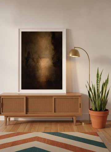 Modern wall art print standing on a sideboard in a mid-century home office