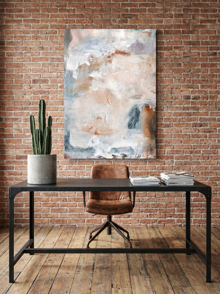 Stretched canvas wall art styled on the wall in an industrial loft home office