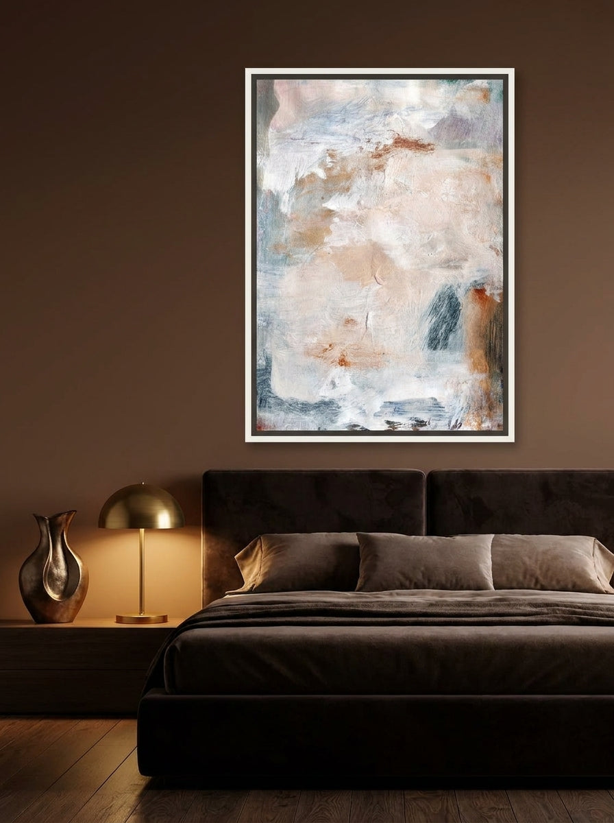Canvas wall art with a white surround styled on the wall in a moody bedroom