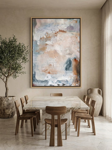 Oversized statement canvas wall art with a natural timber surround styled on the wall in a luxe dining room