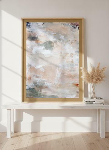Modern wall art print standing on a console in a coastal bathroom