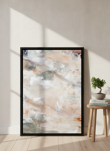 Canvas wall art with a black surround leaning against the wall in a warm Japandi bathroom