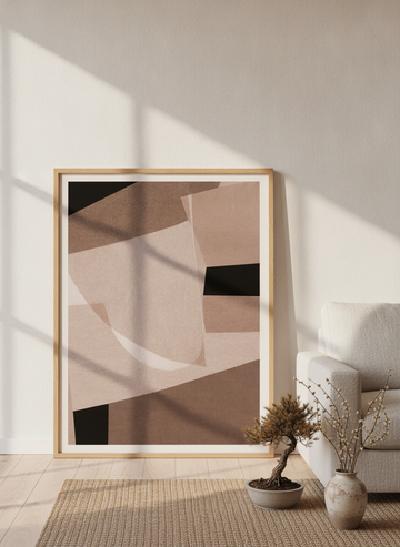 Modern wall art print leaning against the wall in a warm Japandi living room