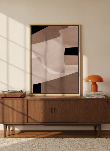 Canvas wall art with a natural timber surround standing on a sideboard in a retro 70s home office
