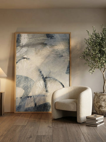 Oversized statement modern wall art print leaning against the wall in a luxe bedroom