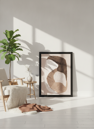 Modern wall art print leaning against the wall in a bright Scandinavian living room
