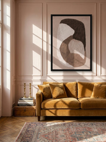 Canvas wall art with a black surround styled on the wall in a Parisian living room