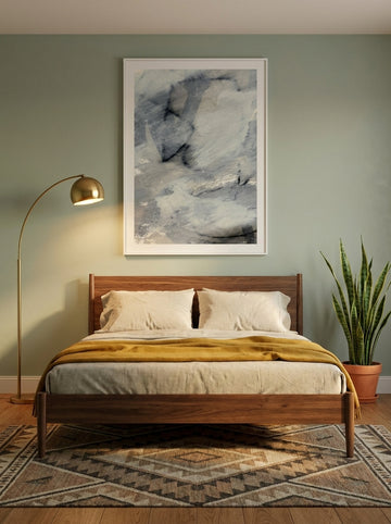 Modern wall art print styled on the wall in a mid-century bedroom