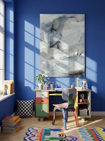 Stretched canvas wall art styled on the wall in a colourful eclectic home office