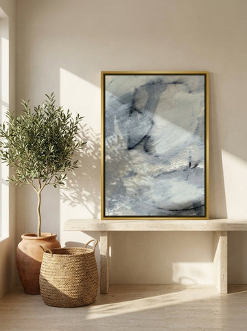 Canvas wall art with a gold leaf surround standing on a console in a Mediterranean home office