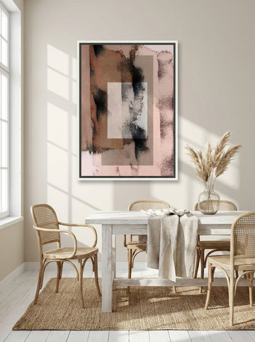 Canvas wall art with a white surround styled on the wall in a coastal dining room