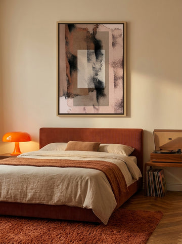 Canvas wall art with a natural timber surround styled on the wall in a retro 70s bedroom