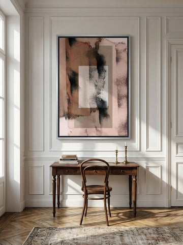Canvas wall art with a silver leaf surround styled on the wall in a Parisian home office